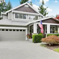 gray house with an American flag out front