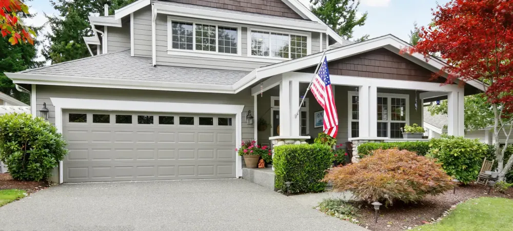 gray house with an American flag out front
