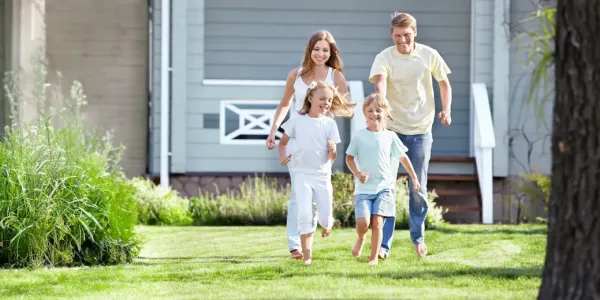 family running and playing outside
